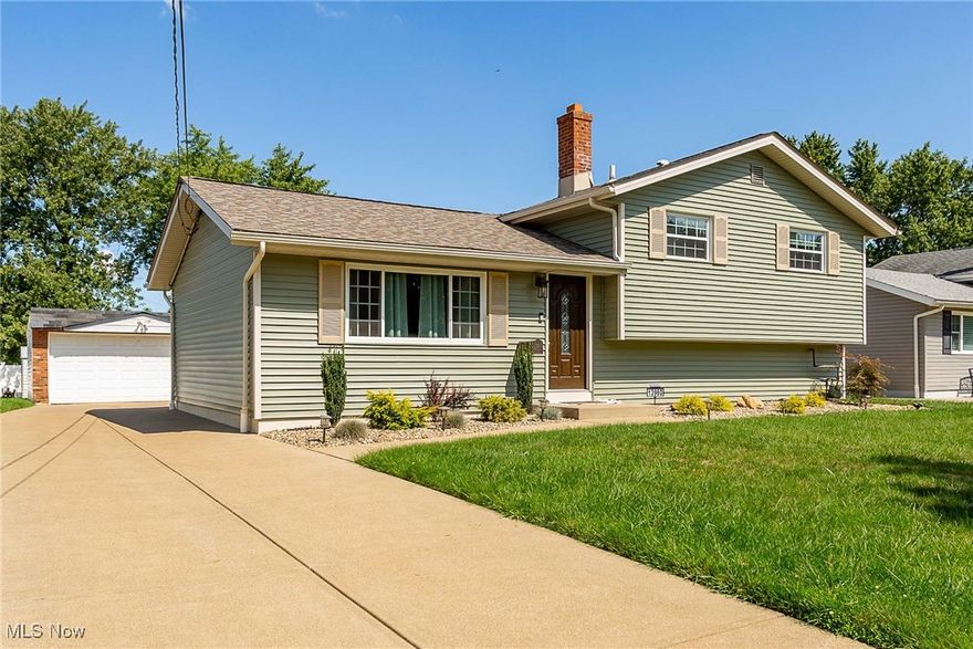 This home is AMAZING!  Be sure to tour this home so you can appreciate the full beauty of this recently updated and immaculately kept home in person.  The home features 3 bedrooms and 2 full baths and has been recently remodeled to feature an open floor plan.  The kitchen incudes granite counter tops, breakfast bar, new cabinets, new appliances, new lights, gorgeous backsplash and luxury vinyl flooring.  The spacious living room features a beautifully updated fireplace, large windows that let in loads of natural light and luxury vinyl flooring.   The three bedrooms upstairs have wood flooring and the main bath has been recently updated as well.  The lower level family room includes an entertainment area along with an additional dining space  and full bath.  The large utiity room/laundry room  is on the lower level.   The private backyard includes a new concrete patio and vinyl privacy fence. Updates since 2021 include vinyl siding, roof, windows, kitchen and family room remodel and whole-house insulation.  The furnace and water tank were replaced in 2023.