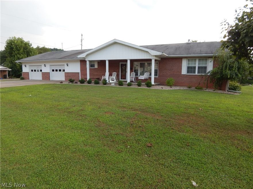 PRETTY AS A PICTURE ON PENN AVENUE!
This beautiful 1,800 sq ft 3 bedroom, 3 full bath brick home has an oversized 2 car garage and sits on a nice, level lot in Pennsboro! Enjoy the covered front porch that makes a nice place to unwind as the day closes and welcomes you to the large living room that has gas logs with a custom wood mantel!  The kitchen and dining room area exit to another covered porch overlooking the backyard area.  Each bedroom has a full bath and larger closets! The oversized garage offers room for a side by side, lawn mower and your vehicles and has a work area and even a utility room!  If the huge garage doesn’t have enough storage, the home sits on a partial, unfinished basement with lots more room for your things!  This well-built home is a must see and is less than 2 miles from Rt 50-4 Lane!  Call for details.