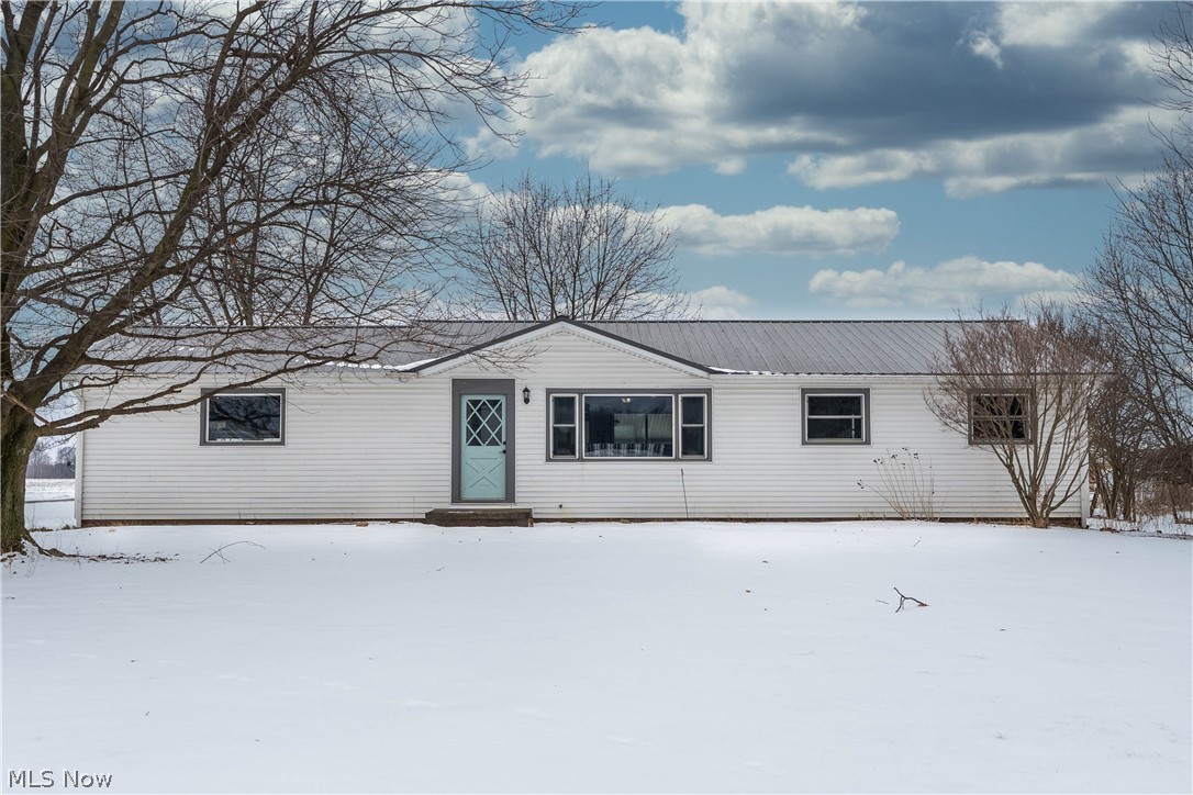 Gorgeous Ranch home with country views! Enjoy the acreage & scenery right from your back porch. Three bedroom home with open concept living room & kitchen. Partially finished basement, with new well components. Attached two car garage.