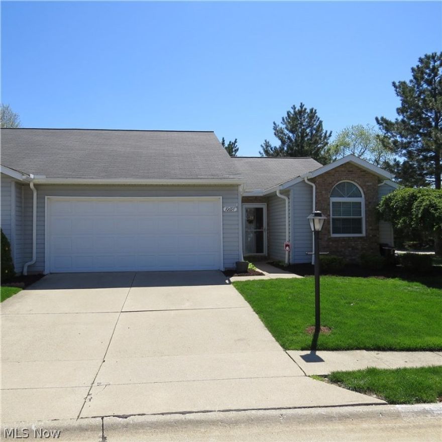 Beautifully maintained ranch cluster home in quiet Strongsville community.  Situated on a large corner lot, this end unit opens to a spacious treed area that provides plenty of privacy.  You will enjoy the charm and function of this immaculately kept home.  The eat-in kitchen has plenty of cabinet and counter space, newer appliances and designer lighting.  A large master suite features walk-in closet and stylish bathroom with new glass shower doors.  Home includes additional bedroom and full bath.  Spacious family room with attractive laminate wood flooring opens to a 3 season room.  Patio provides outdoor enjoyment.  Truly maintenance-free living includes landscaping, snow removal and exterior building.  Home has plenty of storage and good-sized laundry room.  Upgrades include newer furnace and appliances, window treatments, light fixtures, new carpet in bedrooms and luxury vinyl floors in kitchen and baths.  Enjoy neighborhood amenities of Huntington Park Association - Pool, park and