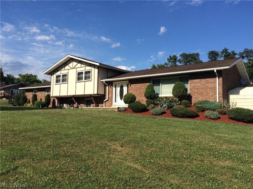 Enjoy living in the country in a park like setting with a beautiful view. Simonton windows with a lifetime warranty and 50 year shingles on a new roof in approximately 2003.  Some newer windows.  New heat pump in 2015 and 1 inch Styrofoam insulations under brick.   200 Amp Service.  Neat little extras include wood chute from the garage into the family room, wood burner, whole house vacuum, sky lights in both bathrooms and sun room. Propane fueled Gas log fireplace in sun room with windows and a sliding glass door to enjoy the view of the back yard.  3 car garage and a large carport which will hold 2 cars or a place to park your boat.  Heated above ground pool open and ready to swim with freshly stained deck. Oak kitchen cabinets and a large pantry.  Pass through window to the large Sun room.  Just minutes away from state route 7.  With added sunroom and finished basement you have over 3000 finished living space.  Call today this house won't last.