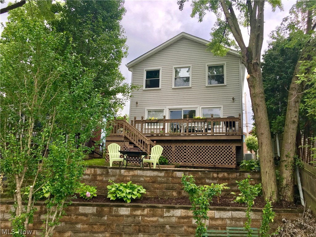 Don't miss this exceptional Lakefront home. Located on a quiet bay off of the east Reservoir, this home was rebuilt from the foundation up in 1993. Enjoy the picturesque views from your deck, stone patio and or from your own dock! The updated home features a modern eat in kitchen and bathrooms, a first floor bedroom and bathroom. Upstairs you will find a very large, vaulted master bedroom with lake views and an attached office or sitting room. The master features 2 closets, one of which is a huge walk in, and a Jack and Jill bath. The second large upstairs bedroom also offers lake views, and vaulted ceiling. 2 Car attached garage and a first floor laundry and mudroom complete this charming home. New furnace in 2013, many newer windows, hot water tank, and water softener system. Basement offers half bath and glass block windows. Nothing to do in this clean and well cared for home but move in and enjoy life on the Lakes!