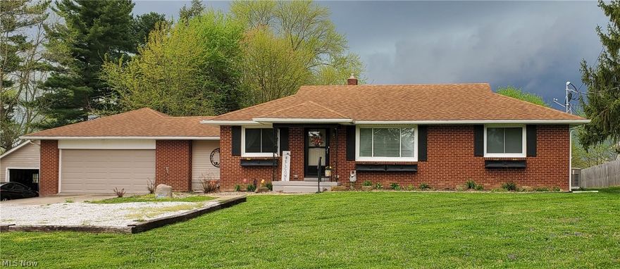 Don't miss out on this fantastic 3 bedroom, fully remodeled brick ranch in Alliance, Washington Township, Marlington LSD.  This beautiful home sits on 1.48 acres, and has been updated inside from top to bottom.  Everything has been touched.  Entering from the 2+ car garage;  you are greeted with a first floor laundry room/mud room where the family can drop their coats and shoes on the new coat cubby, a new kitchen with a stainless steel appliance package is next, there is a new bathroom with new tile floors and tub/shower surround and a new vanity, LVT flooring has been installed throughout the house with carpet in the bedrooms, and fresh paint throughout the home.  This home also features a new HVAC system, water softener. This one won't last, call today!