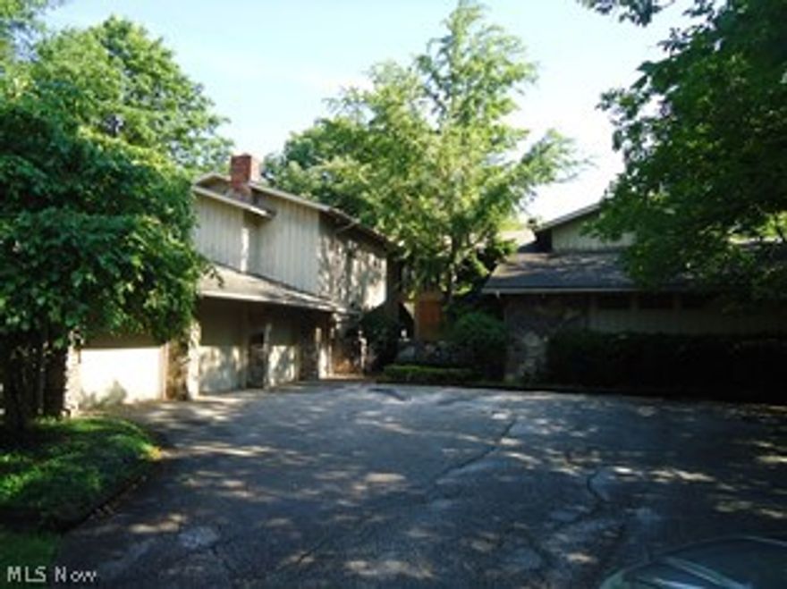 Got to see to believe!! What a scenic view-Home has tons of space and needs a personal touch. Private deck overlooking woods and creek-Private patio off kitchen and family room. First floor master with huge master bath, fireplace and private patio. Family room with wet bar and fireplace. Living room has wall of windows and deck that overlooks the woods and creek. Huge eat-in kitchen. Finished basement with full bath and walk-out.