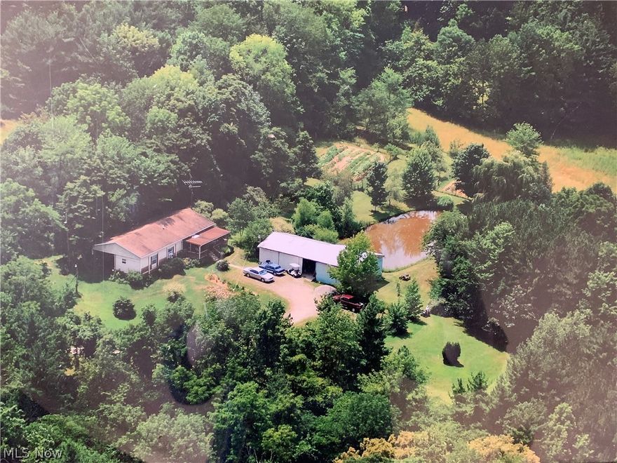 Nestled in the trees is this beautiful 25 acres, just waiting for the perfect buyers to make it their dream home. At the end of the long driveway, you will notice a large pole barn, which includes electricity, perfect for parking vehicles, storing tools, or accommodating the many hobbies of any handyman! Behind the pole barn, conveniently located, is 1 of 2 large ponds that is fully stocked, perfect for fishing, throughout these cool evenings. As you continue to walk this magnificent property, you will notice several flat areas, which would be perfect for building that home your buyers have always dreamed of. With the incredible views, the mature trees, flat acreage and charming ponds, this property will most definitely not last long. Do not delay, schedule your showing today!