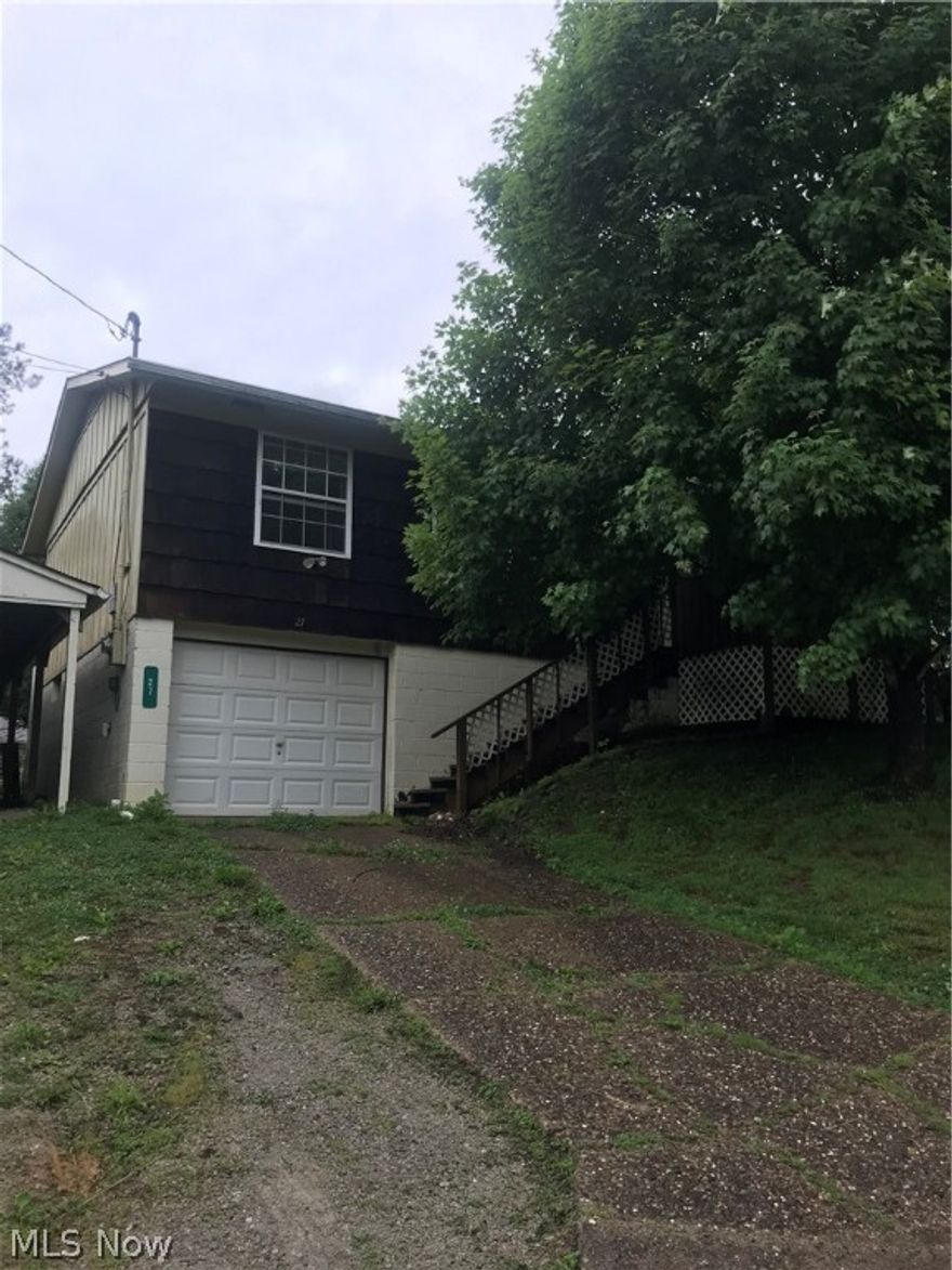 3 bedroom 1 bath, attached garage.  Large fenced in backyard.  Full unfinished basement.