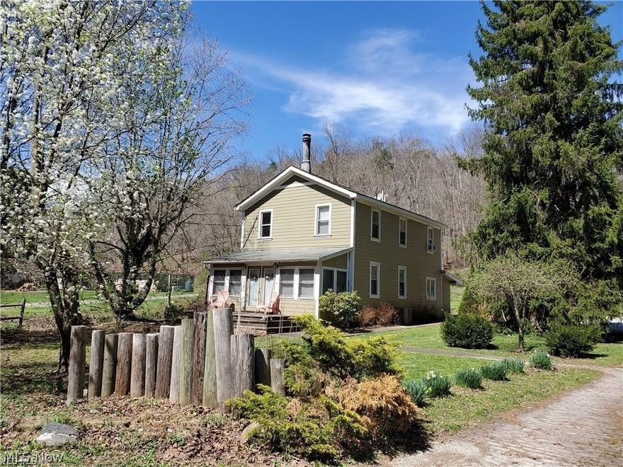 Charming two story home sitting on 1.39 acres just outside of the city. Home is a handy-man's special and is mostly renovated but will require some work to complete. Beautiful hardwood floors, wood burning fireplace, entertainment nook and large exposed rafters adorn the spacious living room. Fully remodeled eat-in kitchen with stainless appliances, new lighting, ceiling fan, and vinyl flooring. Fresh paint throughout. Ornate oak staircase with landing leads up to the bedrooms, all centrally located. Some work is left to be done to the drywall in bathroom, exterior of home resulting from bathroom expansion and some work in the 4 seasons room. Large custom built wooden carport can accommodate 2 cars with more area to park at rear of home. Yard is flat where the home sits with some clearing behind home leading to woods. The surrounding trees give the home a more private feel, especially in the summer. Don't hesitate, schedule your showing today! TB