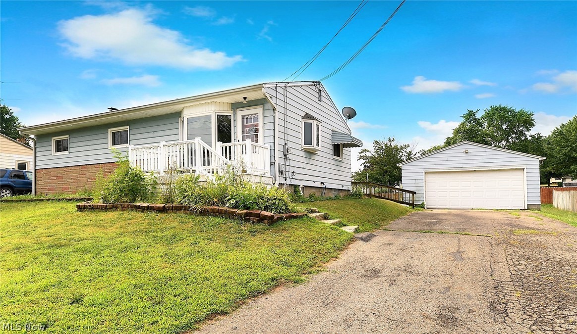 *Looking For A Ranch W/A 2 Car Garage & Great FENCED IN Yard Near Portage Lakes? This Is It!! **Welcome To 830 Garson ~ NICE One Floor Living RANCH Home With 3 Bdrms, 1 Bath, 2 Car Detached Garage With Opener AND .3 Acres! *LARGE Gated FULLY FENCED IN Back YARD Feels Like A Good 1/2 An Acre And Is A MUST SEE For Yourself! *Long Paved Driveway! *Above Ground Swimming Pool *Firepit, Garden Area & Shed * Enjoy OUTDOOR ENTERTAINING & Family Gatherings On Your Own 2 TIER DECK! Partially Covered So It Is Convenient For Changing Weather & Blocking The Sun! Dual Built In Benches & Room For Outdoor Tables, Furniture & Grills! *220 Updated Electric *NEW WINDOWS W/30 Yr. Transferrable Warranty In 2019! *NEW ROOF In 2011 *The Living Rm Boasts Updated MODERN Hardwood Flooring *Archway To An Eat In Kitchen W/Dual Triple Glass Jar Pendant Lighting, Refrigerator And Oven *The Master Bedroom Showcases HIS & HERS Closets & Ceiling Fan *2 Additional Bdrms Side By Side *The Full Bathroom Has Tile Flooring