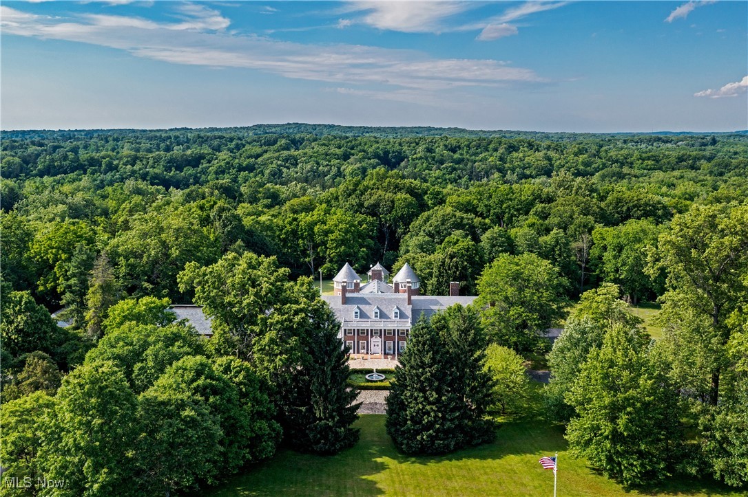 A Once-in-a-Generation Opportunity in the Heart of Hunting Valley.
Set on 7.69 meticulously landscaped acres with a private tennis court and swimming pool, this historic estate offers a rare blend of timeless elegance, modern lifestyle amenities, and income-generating potential—all in one extraordinary property.
Originally built in 1924, this architectural masterpiece showcases the craftsmanship and grandeur of a bygone era, featuring exquisite period details, elegant decor, and refined finishes throughout. With a total of 14 bedrooms and 16 bathrooms, the manor offers unparalleled space for luxurious living, entertaining, or a combination of private residence and income-producing rental units—each with separate entrances.
Whether you're searching for a stately home with room to grow or a distinctive investment opportunity, this estate is as versatile as it is beautiful. The current layout allows for multiple configurations, allowing the owner to reimagine the space to add further units.
Don't miss this exceptional chance to own a piece of Hunting Valley’s history—where timeless character meets modern flexibility in a truly breathtaking setting.