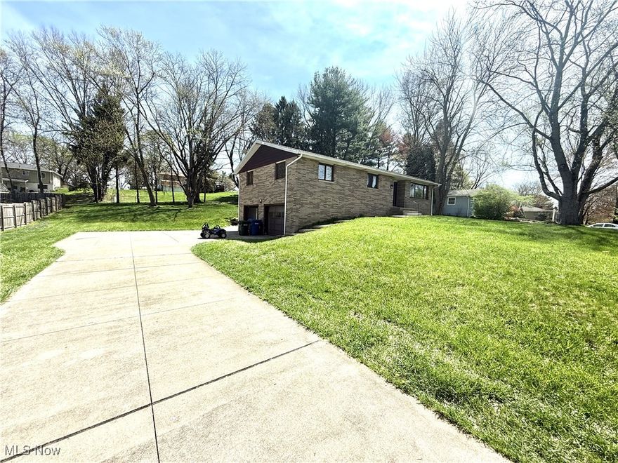 Welcome home to this charming and spacious 3-bedroom, 2-bath brick ranch featuring a full walk-out basement and a warm, inviting layout. Inside, you’ll find beautiful wood flooring in all bedrooms and luxuriously updated bathrooms with elegant marble flooring.

The heart of the home is the spacious kitchen, perfect for cooking and entertaining, which flows seamlessly into the dining room complete with a cozy fireplace—an ideal setting for gatherings or relaxing evenings at home.

The walk-out basement offers endless possibilities for storage, a recreation room, or future expansion. With its classic brick exterior, tasteful interior updates, and functional layout, this home has everything you're looking for.