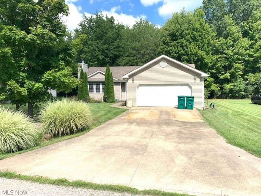 Come see this ranch home in Roaming Shores. This 3 bedroom 2 bath home has a open floor plan,  fenced back patio, wooded back yard and large two car garage. This home is located across the lake and is priced to move. Please come this this home while it last. Seller will look at all offers.