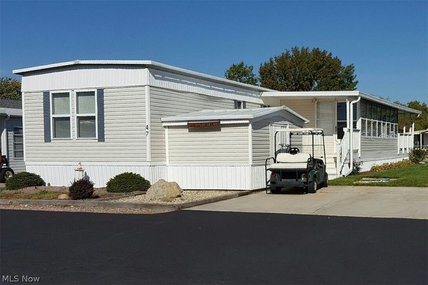 WEST HARBOR LAGOONS CANALFRONT! Well Maintained Two Bedroom Mobile Home with Eat-in Kitchen. Enjoy Great Views from Your Covered Deck and Spacious Three Season Room. Updates Include Newer Roof, Siding, Some Replacement Windows and New 2016 Water Heater. Complete with All Appliances Including Washer & Dryer. Storage Shed with Electric.  Ez-Go Golf Cart Available.