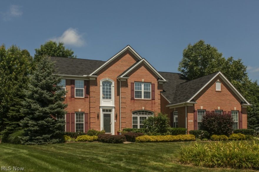 60K Price Reduction!!  Stunning 4 bedroom colonial former model that features almost 5000 square feet of living area.  The gourmet kitchen features 42" upgraded glass maple premium cabinetry, brand new granite counter tops, brand new stainless steel appliances including double ovens, new lighting, and a giant center island.  You will love the sun filled morning room right off the kitchen that boasts a vaulted ceiling and a view of the park like backyard.  Acres of solid maple hardwood floors flow through the first floor.A 22' by 19' family room is also open to the kitchen and features a stone surround fireplace and 9' ceilings.  The formal living room and dining room greet you with elegant bay windows, custom draperies, chair rail, and a tray ceiling.
The dramatic two story entry foyer and grand staircase lead you to the luxurious master suite with recessed tray ceiling, gorgeous double sink glamour bath, a sitting area, and his & hers walk-in closets. 3 additional bedrooms adjoin the