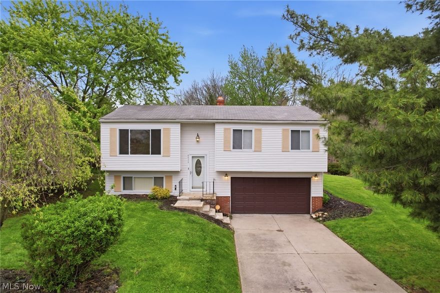 Located in a desirable subdivision on Deer Ct and tucked away at the end of a quiet cul-de-sac, this move-in ready bi-level home offers the perfect blend of comfort, functionality, and location. Featuring 3 bedrooms and 1.5 baths, this well-maintained property has been freshly painted and updated with new carpet, creating a clean and inviting interior. The eat-in kitchen includes a breakfast bar and comes fully equipped with all appliances, offering a comfortable space for everyday dining and meal prep. Step directly from the kitchen onto the walkout deck, perfect for outdoor dining, relaxing, or entertaining while enjoying the privacy of a cul-de-sac setting. The finished lower level provides additional living space ideal for a family room, recreation area, home office, or flexible use. Additional highlights include vinyl windows for energy efficiency and an attached 2-car garage. Situated in Bedford Heights, a well-established Cleveland suburb, residents enjoy convenient access to parks, recreational facilities, shopping, dining, and community amenities, along with proximity to the Cleveland Metro parks and nearby Bedford Reservation offering trails, green space, and outdoor activities. The area is served by the Bedford City School District and is centrally located with easy access to major highways, making commuting throughout Northeast Ohio simple and convenient.