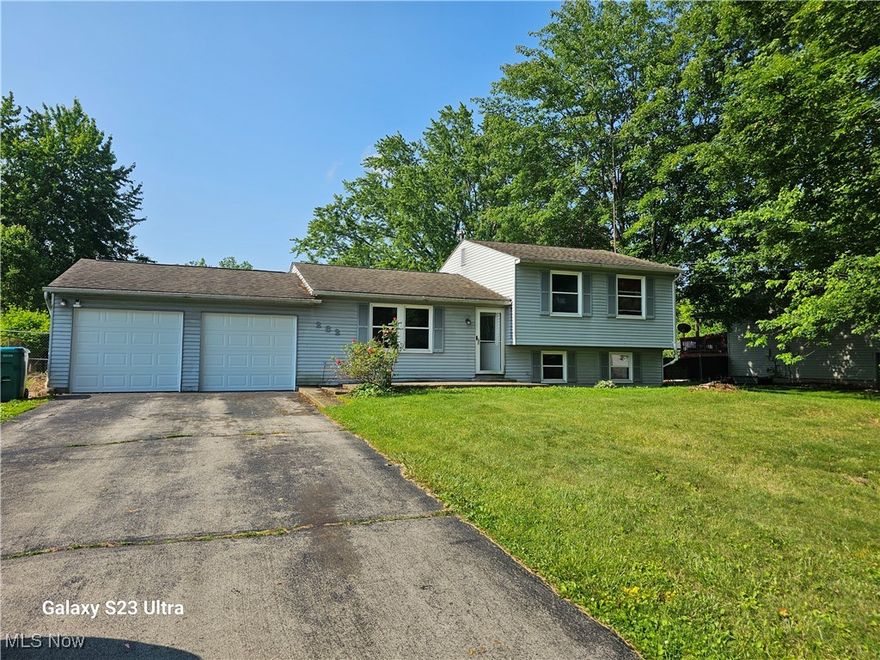Welcome to your new home at 282 Stewart Ave. located in Champion School District. This charming split- level single-family residence is perfect for first-time buyers, growing families, or savvy investors looking for a property with great potential in Trumbull County. Boasting 3 cozy bedrooms and 2 full bathrooms, this home ensures comfort and privacy for all. The heart of the home is its welcoming living room, which flows seamlessly into the dining area, both with laminate flooring that's easy to maintain. The kitchen is a delight with wood cabinets, a convenient pantry, and plenty of storage space for all your culinary needs. Enjoy additional living space in the lower-level family or bonus room, perfect for entertainment or a home office, complete with a handy laundry area. Step outside to a large fenced back yard complete with a patio area for outdoor dining and a shed for extra storage. The 2- car garage is heated and ensures ample parking along with extra storage space. The home also features a smart thermostat, enabling you to control your environment with ease. Fresh paint throughout the home creates a bright and welcoming atmosphere, ready for you to make it your own. Don't miss the opportunity to own this delightful home. Welcome to 282 Stewart Ave., where your new beginning awaits!
