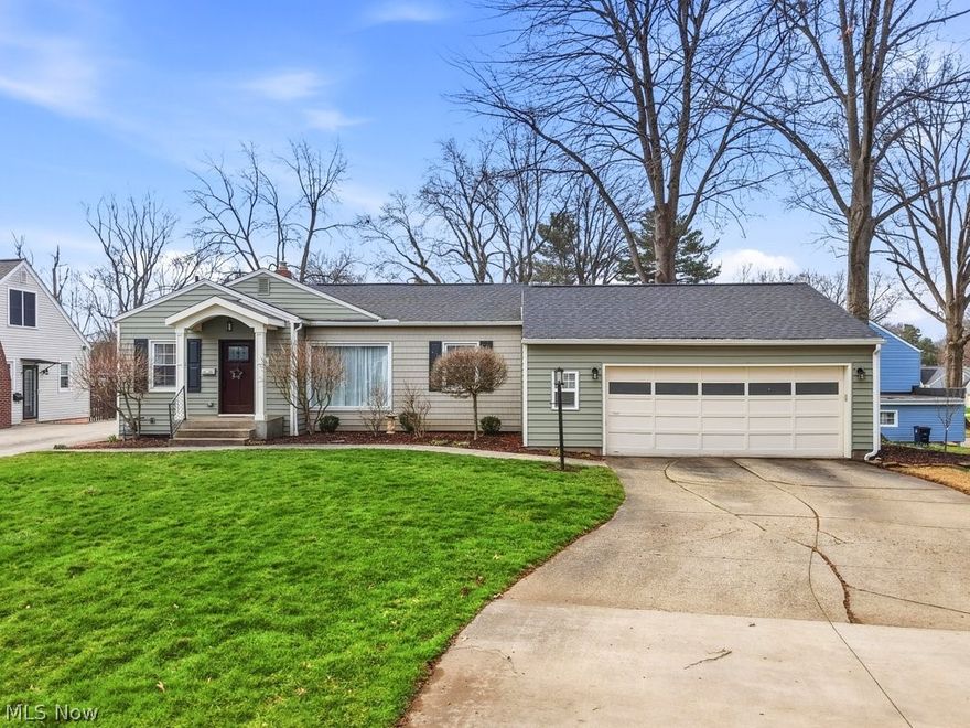 Welcome to 1976 Stabler Rd, an exceptional, fully reimagined residence where thoughtful design meets everyday living in one of Akron’s most desirable locations. Situated on a prominent lot, this property offers a rare combination of privacy, functionality, and high-end improvements that set it apart. From the moment you enter, you’re greeted by a light-filled interior defined by warm finishes and a seamless flow between living spaces. The home has been meticulously updated with luxury vinyl flooring, solid wood doors, and a beautifully refreshed kitchen featuring modern finishes and timeless appeal. The true centerpiece is the expansive owner’s suite, expertly designed through a full reconfiguration of the original layout. This private retreat offers a spa-inspired bath complete with a jetted tub, glass-enclosed shower, and an oversized walk-in closet, delivering a level of comfort rarely found in homes of this style. Additional living spaces provide flexibility for both entertaining and everyday living, while thoughtful upgrades ensure long-term peace of mind. Step outside to a professionally enhanced exterior with updated landscaping, drainage improvements and a welcoming deck ideal for outdoor gatherings or quiet relaxation. A truly rare highlight is the oversized outbuilding, perfect for RV or boat storage, a workshop, or hobby space, an uncommon amenity that adds both function and distinction. Ideally located near shopping, dining, parks, and major commuter routes, this home offers the perfect balance of convenience and refined residential living. Extensive capital improvements include: full exterior siding replacement (2022), new roof (2020), kitchen renovation (2020), HVAC conversion (2018), whole-house generator (2025), sewer line replacement (2017), and a complete luxury primary suite transformation (2017). Do not miss this rare opportunity to own a turnkey home with elevated finishes and standout features in a premier location!