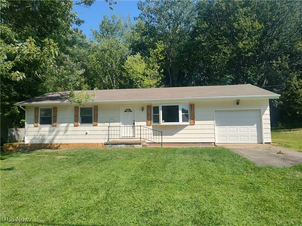 Fresh, clean, and ready for you to move right in and make this house your home!! Welcome to 8016 Ninevah Rd, a 3-bedroom ranch located in Saybrook Township that has just been gone through and freshened up to be ready for its new owners. The 1 car attached garage with a concrete pad welcomes you and as you walk in you will notice the open floor plan concept that provides plenty of layout options for you to meet your needs. The living room complete with a bay window overlooking the front yard, offers a spacious 234 square feet of space. The kitchen has been completely remodeled with new flooring, cabinets, countertops, range/oven as well as a stylish new range hood. The laundry area is conveniently located right off the kitchen so there are no stairs to contend with. Down the hallway the 3 bedrooms have plenty of closet space, a fresh coat of paint as well as new flooring thought out combined with the completely remodeled bathroom offers a convenient layout. Outside enjoy the deck located right off the kitchen to make entertaining a breeze or enjoy some much deserved solitude as you look over the park like backyard that backs up a nicely wooded area. A solid home that is easy to maintain and all the hard work is done for you so all that is left to do is call today for your personal tour!