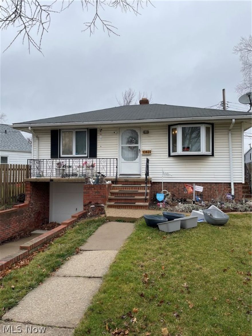 Charming cozy home. Updated electrical, newer water tank. Central air. Conveniently attached one car garage with Nature Stone floors. Glass block windows in the basement. Security systems.  Newer roof. Priced for quick sale.