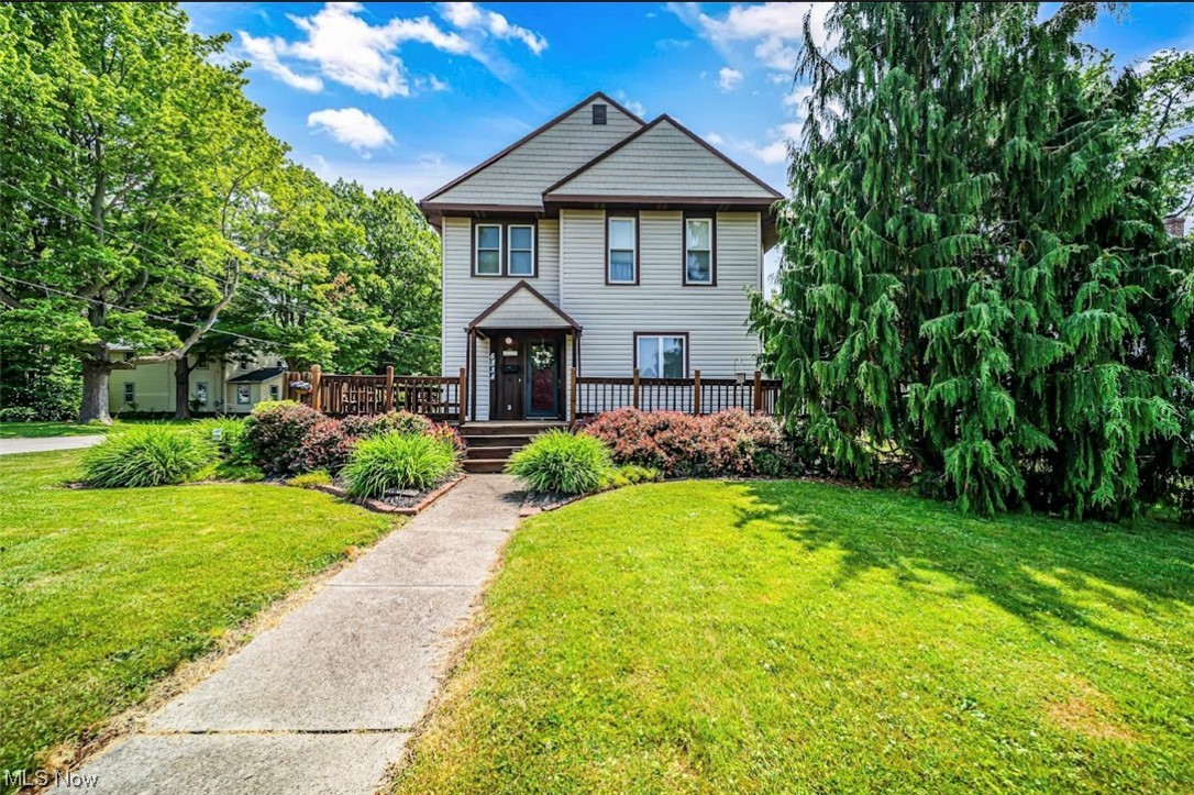 Welcome home to this meticulously maintained beauty, set back from the street on a corner lot with a lovely front deck. Enjoy the two car detached garage just off the back the home with electric. The interior is a sight to behold. Upon entering the large bonus room, enjoy conveniences such as a full bath and laundry tucked away behind closet doors. The shiny new ceramic tile in the kitchen will catch your eye for sure! Upstairs you will find all 4 spacious bedrooms and full bath. Fully carpeted bedrooms, but hardwoods under all except Main bed/bath. One bedroom is being utilized as a walk in closet/storage area. All appliances stay. Furnace replaced in 2022, Hot water tank 2020. This well-loved home is sure to check a lot of boxes!