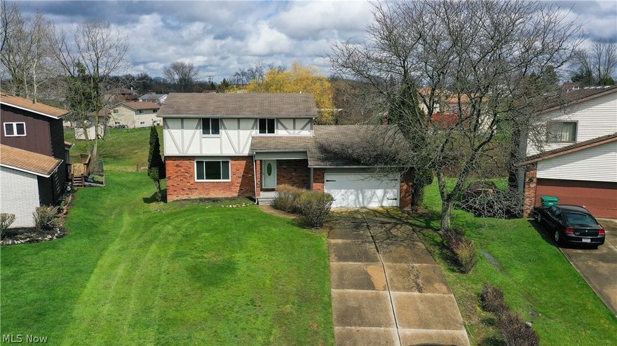 Incredible 3 bed, 1.5 bath home located in Oakwood. Inside you will find the home updated with nearly 1300 square feet of newly installed luxury vinyl floor running throughout the living room, dining room, kitchen, and family room. The kitchen and family rooms boast an open floor plan, and a gorgeous brick fireplace is set at the far wall. Step out onto the well-maintained deck off the family room. Here you can enjoy and entertain friends and family, or relax alone with a great view of the area. Newly installed carpet greets you at the stairs to the second floor where you will find the owner's suite with closet nook, make-up counter, and attached bathroom, and 2 spacious guest bedrooms with ample closet space. In the full basement, you will find even more finished living space with the dry bar and plenty of room for additional recreation and entertainment.