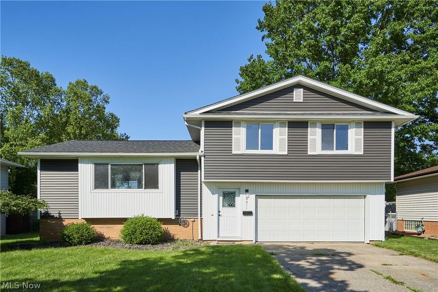 Beautiful Parma Heights Split Level home that has been meticulously maintained and is move-in ready! New windows installed in 2016, siding, roof, and insulation replaced in 2020, and a new hot water tank in 2022. This charming home welcomes you to a peaceful neighborhood with its attractive curb appeal and perfectly sized yard. Step inside through the garage or front door to find a foyer/mud room boasting ample storage space and a convenient bench for shoe and boot storage. The hardwood floors have been expertly refinished, and the entire home has been freshly painted. Enjoy the seamless flow between the living room, dining room, and kitchen, ideal for both daily living and entertaining. The slider opens to a deck, covered patio, and fully fenced yard. Don't miss out on the chance to see this stunning home - call today for your private showing before it's gone!