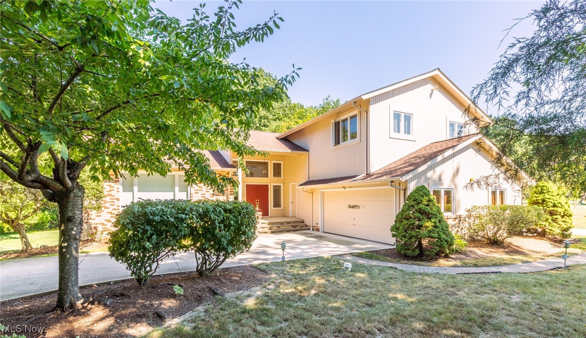 Pristine and well maintained Oversized Split Level on prime Pepper Pike cul-de-sac street! Situated on a scenic, wooded one acre lot, this home offers many updates and has abundant natural light throughout. Two story foyer with ceramic tile floor steps up to vaulted Living and Dining rooms in classic “L” shape with gleaming hardwood floors and newer (2024) skylights. Gourmet Kitchen with newer Stainless Steel appliances including double oven, planning desk, plenty of counter and storage space, and ample dining area has newer (2024) skylights. Spacious Family room has a wall of windows overlooking the private, park like patio and backyard, plus a stone fireplace feature wall and a wet bar for entertaining all types of gatherings. Living suite on first floor has full Bath and Bedroom plus separate entrance, ideal for home office/in-law suite! Convenient first floor Laundry with garage access. Second level Master Suite with updated full Bath has jetted tub and stall shower, plus a oversized walk-in closet and sliders to balcony! Three more sizable bedrooms share updated full Bath in hall. Loft area could be a reading nook or sitting area. Walk-out Lower Level has huge Rec Room plus additional storage. Newer 2024 Roof! Newer 2019 Circular Drive with pull-through Garage! So convenient to dining at Eton Chagrin Blvd, shopping at Trader Joe’s, Village Square and Woodmere, plus easy highway access. Award Winning Orange Schools.