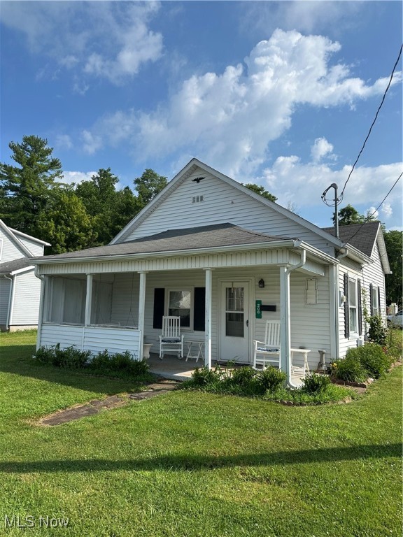 Welcome to the Charming, Cute 208 Center Street Cottage featuring one bedroom, One Bathroom, Laundry area located in the Bathroom on main floor. Relax on your front covered porch with swing and two rocking chairs, walking into the spacious Living room.
Eat in Kitchen includes gas stove, Frig, with an exit door to outside near the Carport and back yard. One Bedroom. Bathroom includes a shower, vanity, small closet and washer & dryer. Nice back yard includes a car port, Shed and Building for plenty of storage. Home is located in the Center of Woodsfield, walking distance to Down town. Home has dual heating sources with Gas wall unit and baseboard Electric heating. This home has Woodsfield utilities, water, Electric and Sewer. Home is sold as is. Schedule your appointment today.