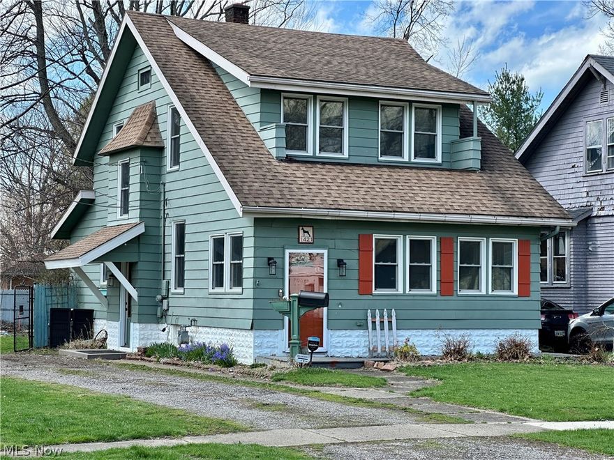 Welcome to 1421 Ohio Ave — a character-filled home offering a blend of updates and opportunity. The warm and inviting main level features updated flooring, natural light, and original architectural details that add charm and personality throughout. A front sunroom provides additional flexible living space, while the living and dining areas offer a comfortable, functional layout with room to make it your own. The kitchen has been updated with modern cabinetry, a stylish backsplash, and includes stove, microwave, and dishwasher. French doors off the dining area open to a composite rear porch with steps down to the backyard, creating an easy indoor-outdoor connection. Upstairs, you’ll find three bedrooms and a full bathroom featuring a tiled walk-in shower and contemporary finishes, along with access to a walk-up attic offering additional storage or potential flex space. The basement includes laundry with a utility sink, and washer and dryer (newer front-loading units) are included, along with additional storage and utility space. Additional highlights include updated windows (2021). Situated on an oversized, fenced lot, the property offers a nicely sized backyard with multiple outdoor areas, including a patio off the rear of the home and an additional patio space near the garage, complete with a pergola-style structure for shade and relaxation. Conveniently located near Historic Ashtabula Harbor, Lake Erie, local schools, and Kent State University, this home offers both accessibility and lifestyle appeal. Priced to reflect condition, including typical maintenance considerations for a home of its age — schedule your showing today.
