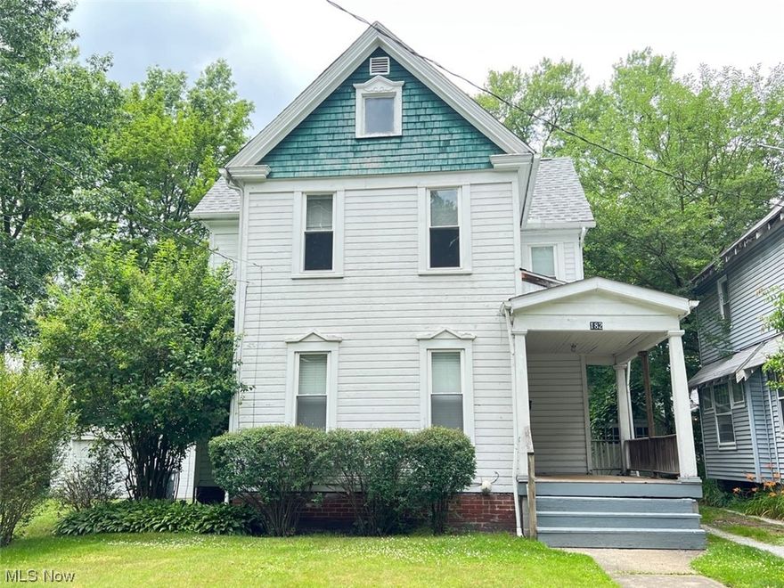 This property has been used as a legal two unit for a long time and can still be used that way. With only one furnace and one electric box, the highest and best use of this property is as a single family. This will easily convert back. The dining room has the original stairs to the second floor behind the built in bookcase. The first floor bedroom and full bath is great for someone who can't do stairs well. The huge kitchen is at the rear. On the right side of the house is the original shared driveway and includes one half of the garage at the end of that driveway. On the other side, the owner purchased an entire separate lot and built a beautiful 2-car garage in 2000. There is ample parking on the extra lot without having to use the share driveway at all. The upstairs "laundry" room is the old kitchen and there are cabinets in the garage to complete this project. It makes a perfect laundry room. The roof and gutters are only 3 years old. Three sides of the house need paint as the back of the house has vinyl siding.