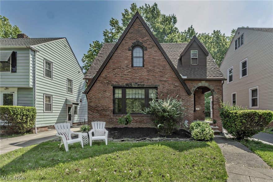 This is a charming, move-in ready brick bungalow in the heart of Cleveland Heights.  After entering the delightful front porch, the first floor showcases the character of a craftsman-built house.  There is detailed millwork, lovely hardwood floors and light neutral paint throughout the home.   There is a decorative stone hearth in the living room and built-in corner cabinets in the dining rooms.   The home features a renovated eat-in kitchen with white shaker cabinets, granite countertops, newer stainless steel appliances and luxury vinyl tile.  Upstairs, you'll find two bedrooms and a full bath, with the oversized primary bedroom offering built-in closet organizers in the dressing area and a "Juliet" private balcony overlooking the backyard. There is additional storage with the center hall cedar closet + linen closet.  Other updates include a tear-off roof (2016), a new concrete apron (2021), recently seal-coated driveway (2024) and two newer water efficient toilets (2024).  The basement includes a half bath, unfinished bonus room with recessed lighting, laundry hook ups and the home has been professionally waterproofed with a sump pump.  This home will transfer Point of Sale compliant with the City of Cleveland Heights and is conveniently located with access to downtown and Cleveland's cultural hub at University Circle, world class medical care from the Cleveland Clinic and University Hospitals.  All this and a one year home warranty as a housewarming gift .... You'll enjoy the opportunity to make this house your home!