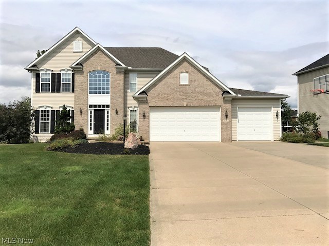 Welcome to Springbrook Reserve in Stow. This charming colonial offers hard wood flooring in the spacious entry way, open floor plan, newer carpet in the living room, newly finished partial basement with a wet bar, new roof 2017, beautiful deck with a waterfall feature. Gorgeous wooded view in the back and nicely located on the cul de sac. Master bedroom features huge walk in closet with a great master bath with shower and soaking tub. 3 car garage and built in lawn sprinkler system, too! Schedule your showing now as this will not last!!!