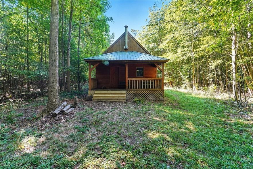 This nearly 14-acre getaway offers the perfect escape from the everyday. Tucked away on two parcels, you’ll find a rustic off-grid cabin surrounded by woods, marsh, and wildlife—an ideal spot for hunting, weekend getaways, or simply soaking in the peace and quiet of nature.

The cabin has been thoughtfully improved, blending rustic charm with modern comfort. New windows on the rear covered porch invite natural light and beautiful views. Updated lighting, furnishings, appliances, and an expanded yard with a solar system enhance both function and ease of living. Enjoy morning coffee on the screened-in porch, and cozy up beside one of the two wood stoves as the evenings cool. A convenient outhouse is also on site.

Access to the cabin is via a winding path, adding to its privacy and adventure. Once there, you’ll find room to breathe, space to roam, and endless ways to enjoy the outdoors—whether hunting deer and birds, entertaining friends, or simply sitting under the stars as the fire crackles.

Come experience the stillness of the countryside and imagine evenings spent under a sky full of stars at your very own off-grid paradise.