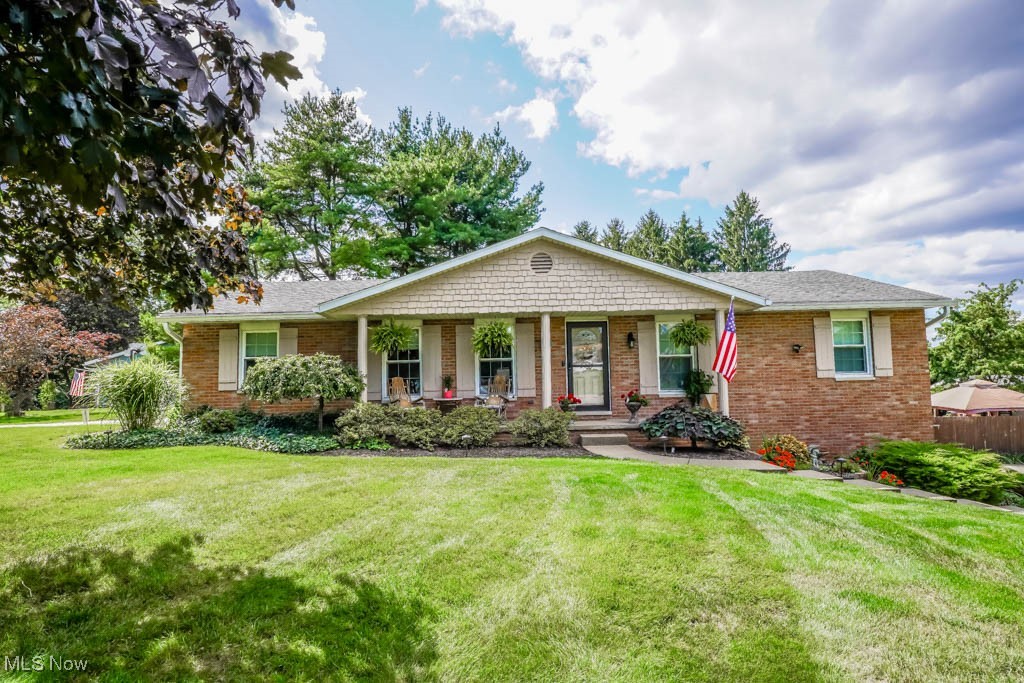 Dreaming of a home with space, style, and an incredible backyard? This updated all brick ranch in Greentree offers all that and more, including North Canton schools. Inside, the open layout connects a light filled living room complete with hardwood flooring and lighted display niches to a stunning eat-in kitchen with custom cabinetry, stone counters, stainless steel appliances, and a farmhouse sink. Enjoy meals at the breakfast bar or in the dining area by the fireplace.
Tucked just around the corner, a spacious butler’s pantry doubles as a laundry room with tile flooring, a 2nd refrigerator, and abundant cabinet storage. A cozy family room addition adds a quiet spot to unwind by the stone fireplace and also leads to the backyard.
Two main floor bedrooms and two full baths include a primary suite with a walk-in closet and a private bath featuring a barn door entrance, heated tile floor, step-in tile shower, and a bureau style vanity with vessel sink. The second bedroom offers a double closet and easy access to another beautifully updated full bath. Downstairs, the third bedroom (currently used as an office) features an egress window and access to another full bath. The finished rec room with an epoxy floor is great for games and leads to the two car garage with a separate workshop.
Outside is where this home truly shines! Step onto the deck and take in the 30x60 heated saltwater pool, cabana with an outdoor bathroom, and a separate fenced space for pets. A fantastic custom home you won’t want to miss, call today!