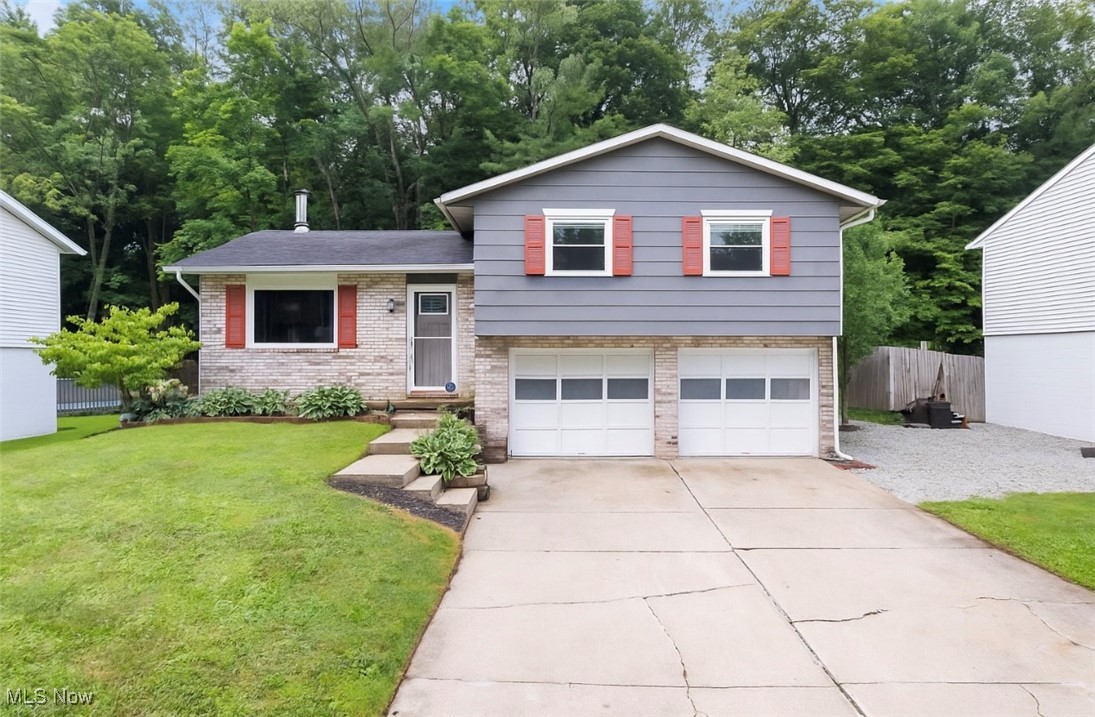 Welcome to 413 Stonewood, a beautifully updated 4-level split in the heart of Canal Fulton and within the desirable Northwest School District. Offering 3 bedrooms and 1.5 bathrooms, this home is designed for both comfort and functionality with plenty of storage and space to spread out. Enjoy two distinct living areas – a family room with a cozy fireplace and a living room with a wood-burning stove – perfect for relaxing or entertaining. The updated kitchen and brand-new bathroom with a walk-in shower add modern style, while the layout provides tons of storage throughout. Step outside to a large deck overlooking a spacious backyard and peaceful wooded views – ideal for morning coffee or evenings outdoors. Major updates include: Newer roof; Windows; HVAC system. Close to highways, shopping, and restaurants, this home offers the best of convenience and charm. With its versatile 4-level design, tons of storage, and inviting spaces, 413 Stonewood is move-in ready and waiting for you!