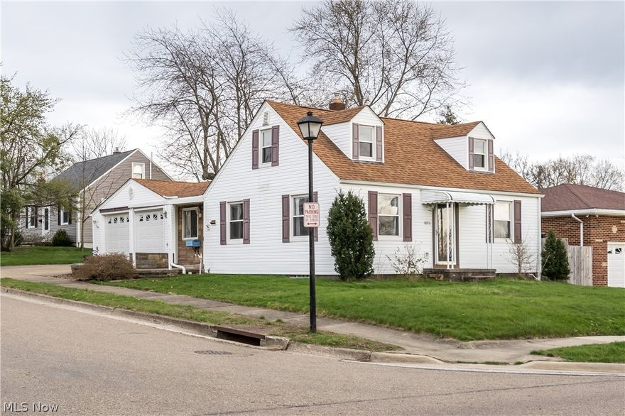 Smartly situated on a corner lot in Firestone Park is this lovely number. The area is known for classic cape style homes, but this one has a little more to offer than the typical. Inside you'll be pleased to find an open floor plan. The kitchen is placed in between two living spaces and has enough room to whip up your favorite meal. The main family room features an earth toned stone fireplace and is flanked on either side with built-ins. The other living area is large and comfortable, it could easily sustain a few game night parties. Two bedrooms, each with hardwood floors, and a full bath complete the first floor. Upstairs is the enormous third bedroom with gorgeous knotty pine panelling. One more note worthy item is the attached two car garage...definitely a rarity and you'll be appreciative when it's raining or super cold outside. This spot is one you won't want to pass up. A few updates to mention, new furnace and A/C installed 2016, garage door openers 2018, hot water tank and sum