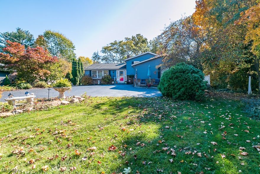 South Mentor Gem: Stunning Four-Level Split-Level Home

Nestled in south Mentor's serene woods, this four-level split-level home blends contemporary elegance with classic charm. The first floor boasts new laminate wood plank flooring, enhancing the modern appeal. The kitchen, an entertainer's dream, features new cabinets, a 32 square-foot island, granite countertops, and a ceramic backsplash.

This home includes 3/4 bedrooms, with a master bedroom featuring a Jack and Jill bathroom, additional large bedroom with double closets. Both bathrooms are newly remodeled, with updates in 2022 and 2023.

The lower level hosts a vast family room with a wood burning fireplace, garage door entrance, ideal for entertainment and relaxation. Also, a bonus finished basement with an additional bedroom or office.

Exterior features include a welcoming front patio, a wraparound wooden deck for private outdoor enjoyment, and a 6-foot high white vinyl fence for privacy. Energy-efficient windows on the second floor add to the home’s appeal.

Additional perks include a two-car attached garage, an extra-large driveway, and recent updates like new carpeting and painting (2022-2023).

A perfect blend of updates and timeless elegance, it's ready to be your forever home. New HVAC 2017, New Windows 2nd Floor 2022, Basement Carpet 2023, Whole Main Floor Remodel 2013,  Bedrooms New Paint and Carpet 2022, Bathrooms Updated 2022 / 2023. MUST SEE.
