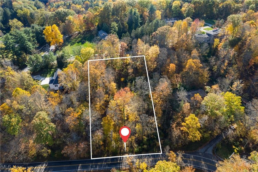 Rare opportunity for a 1.32 acre building lot in an established neighborhood in beautiful Bath Twp.  Scenic hilltop location on a quiet park-like setting surrounded by forest.  Monthly HOA fee includes Oak Knoll’s EPA regulated private sewer & water system.  Wonderful privacy and views to build your dream home.  Bring your own builder, or full plans are available for a custom hilltop home from the current owner’s builder.  Lot is accessed from a private driveway located just West of the front of the lot on Revere Rd.  Lot has frontage on Revere Rd and Oak Knoll Dr.