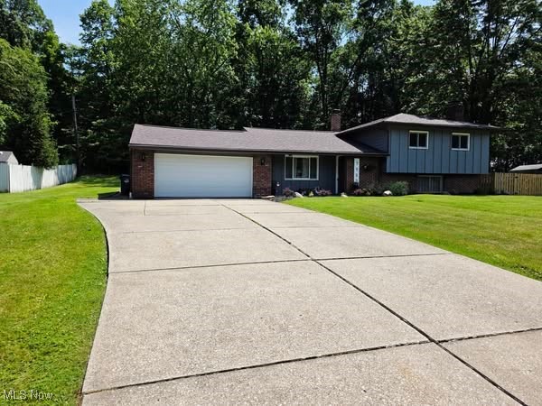 DO NOT MISS THIS ONE! Situated in beautiful North Royalton this SPECTACULAR home boasts a GORGEOUS COMPLETELY UPDATED kitchen with stunning granite counters, vaulted ceilings, upscale stainless steel appliances, brand new upscale lighting, a breakfast bar, ample counter space & storage, & flows right into the dining space as well as has a slider leading to the breathtaking grounds with newer patio perfect for entertaining! The enormous living room is just off the open concept kitchen & dining space & all spaces blend perfectly for an open feel! On the lower level you will be pleased to find the cozy yet sun kissed family room featuring a BEAUTIFUL fireplace, built in cabinetry, & classic wainscoting! Just off the family room is a very spacious laundry room that can be partially used as a flex space based on your needs! The upper level features three large bedrooms with ample closet space! The bath is completely updated & has a tranquil spa-like vibe! Attached 2 car garage! Newer Hot water Tank! Central Air! SPOTLESS! TURN KEY! FANTASTIC LOCATION! THIS IS A MUST SEE!!!