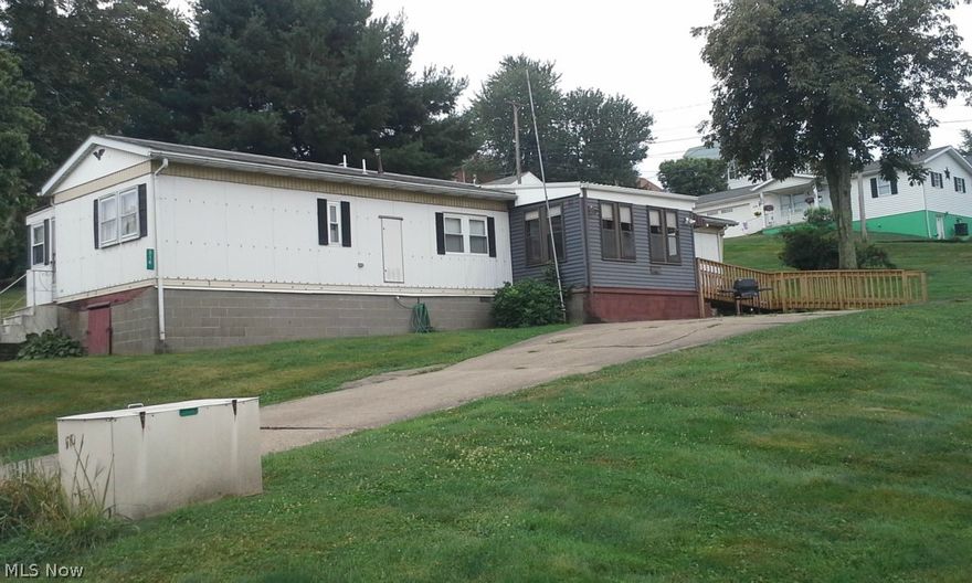 Mobile home on 4 lots in town. Needs some TLC but would make a nice starter home.