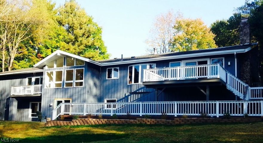 Drive into nature when you visit this spacious lake front ranch home on a private road in the heart of Bath. This home has 5 bedrooms and 4 full baths on a wooded 3+ acre lot. Enjoy the stainless steel kitchen and granite countertops. Entertaining will be easy in the eat in kitchen, the open dining and family room, large living room, a lower level recreation room that has access to the back yard, and a two tiered deck that overlooks the lake. There are hardwood floors or new carpeting throughout for you feet to enjoy. For your convenience you will find a first floor master bedroom and a second master on the lower level. For your peace of mind you will find a new roof, new septic system, new waterproofed lower level, new foundation repair, and this home was been freshly painted inside and out. For your protection the owners are providing a home warranty.