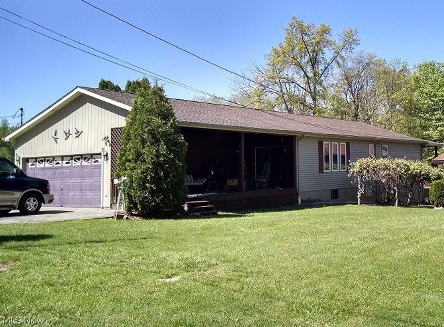 Nestled in Nature!! This Lake Milton Lakefront home is perfect for entertaining on the Lake!! 3 Bedroom 3 Full Bath Ranch and 2 car attached garage with Full walkout basement and extra kitchen. Huge 35x10 Deck overlooking the lake. Gradual decline for the walk to the shore and your private dock. Home also has a large shed and 1 car detached garage for additional storage.