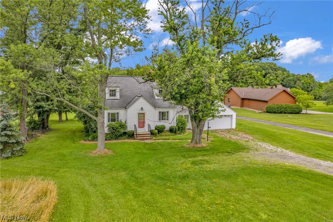 Looking for peaceful living with your own land yet still desire to be close to travel, restaurants, and shopping? Opportunity knocks in the right location! This 3 bedroom home is waiting for your personal renovating touches and with your vision and skills will be the perfect home for a lifetime of memories. Situated on 4.5 acres of land that is mainly wooded you can create fun adventures thru your own park, tend to any gardening hobbies, host a game of touch football or if you prefer visit nearby Metroparks to dial up the activity. Inside you will find hardwood floors and an open kitchen overlooking the backyard. Two bedrooms are on first floor with the full bath and a master bedroom on the second. This home also known by many neighbors and locals as the “Daffodil House” for the stunning full flower garden in the front is ready and waiting for you to take it to the next level for years of future enjoyment while being close to all. Home is being sold AS-IS. Where the city meets the c