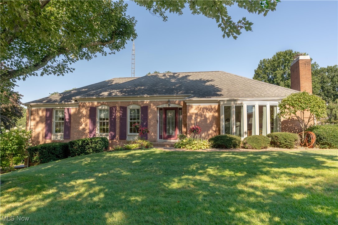 Immaculate brick raised ranch on a private, quiet cul-de-sac in the desirable Wilkshire neighborhood. Ready for you to move in and ENJOY! Attention to detail and quality are evident at every turn, with gleaming hardwood and ceramic tile flooring throughout, granite countertops, and so much more! Stepping into the entry foyer you will find the large and lovely living room, complete with a gas log fireplace and an extra sitting room that's perfect for reading, watching TV, your home office setup, or singing around the piano...imagine the cozy holiday memories to be made! Through the foyer is the dining area where you'll find yet another brick gas log fireplace. The open dining / kitchen areas are an entertainers dream, with plenty of room to gather. The kitchen features granite countertops, ceramic tile floor and custom hickory cabinetry along with a view and french doors leading to the stamped concrete patio, pergola, and gorgeous back yard. The convenience of a half bath, a main floor laundry and a pantry closet round out this end of the home. At the other side of the dining room lies the hallway to 2 bedrooms, a full bath, and the primary suite with walk in closet and full bath with tiled walk in shower. The lower level is a woodworker or crafters dream, complete with a 34 x 17 workshop and additional space that's just ready to be finished to fit your every need. Exit through the 2 car attached garage to enjoy over a half acre of beautiful yard with abundant flowerbeds and plenty of privacy. All of this, tucked away in a tranquil neighborhood, yet convenient to EVERYTHING! Schedule your showing today, you need to see this home to appreciate how truly special it is!