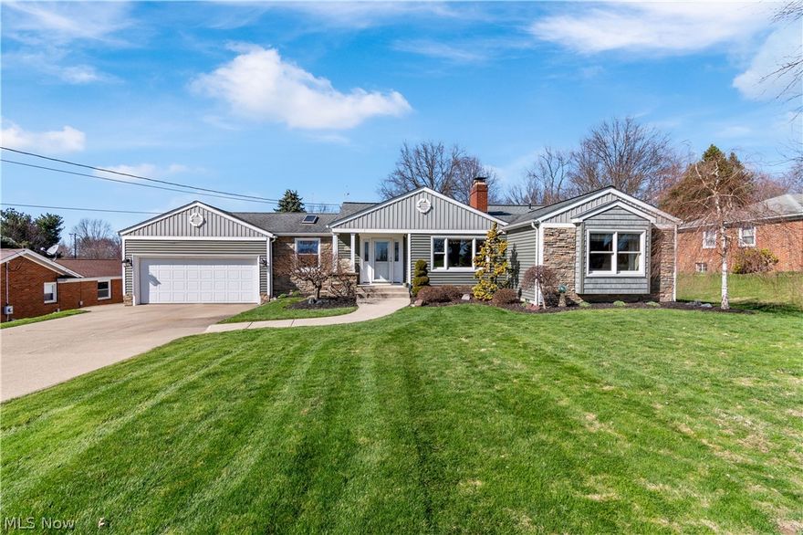 Tucked away on a large and lush lot peppered with mature trees, this beautiful home is in the perfect location just minutes from Firestone Golf Course and Firestone Metro Park. Modified and updated to be completely wheelchair accessible, this bright family home shows tons of pride in ownership – apparent in every inch of the space. As you step inside, you will find a large home office to one side and a beautiful living room to the other. Rich hardwood floors, custom built-ins and a stunning feature fireplace welcome you as you make your way through the space. An effortless flow guides you next through the kitchen overlooking the large dining area. Tons of custom cabinetry and updated stainless-steel appliances make the space as functional as it is beautiful. 

Outside, find even more entertainment space on the oversized deck overlooking your large lawn. Soak in the sun or enjoy a meal, with ramp access down to the lush and private backyard. Back inside, find a large master suite with