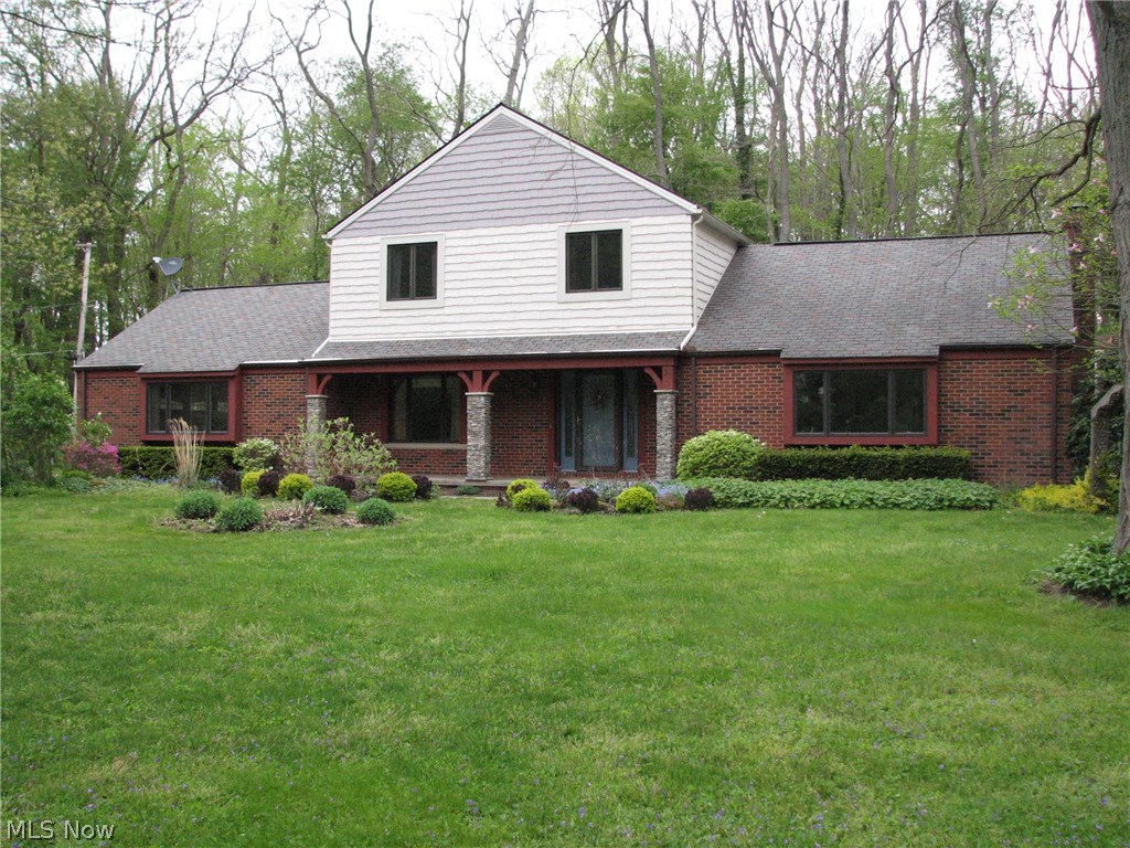 On a secluded dead end road with walking distance to Lake Erie, this home sits on almost one acre. Beautifully landscaped w/unique varieties of rare flowers. Enjoy the huge brick patio w/pergola and huge white pillars that makes it stand out. Step in from the patio through the sliding glass doors into this spacious 4 bedroom 2 1/2 bath Colonial Home. This home provides 2 Family/Living rooms that can be used for just about anything. One has a full brick wall with wood burning fireplace. You can also choose from the eat-in kitchen with ceramic title and new gas countertop range or a formal dining room for those special occasions. The master suite has its own private bath which has been totally remodeled. There are 3 more spacious bedrooms along with another totally remodeled full bath. The hardwood floors are gorgeous throughout. BUT WAIT!! If this isn't enough this home also provides a finished basement for many different uses. Can be used for a mother-in-law suite, recreation room or
