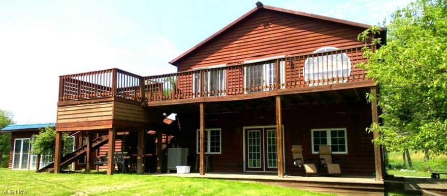 Private Property on 1.31 acres. 1 mile from the Marina. If you want lake property this is the ideal place. Features 4 bedrooms 2.5 bath with efficiency apartment attached. This cedar home is spacious and boasts lots of opportunity.