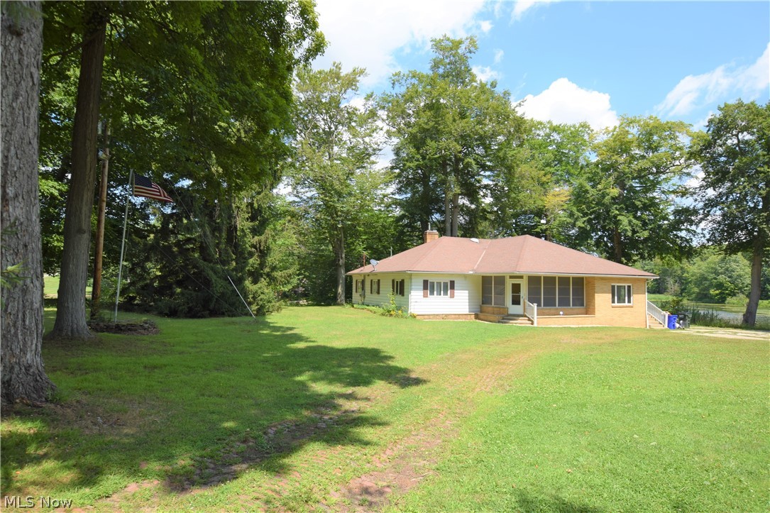 Welcome to 10578 Infirmary Road! This 4-bedroom, 2-bathroom home sits on just over 13.5 acres of land in Mantua. This peaceful property overlooks a large pond and has a massive detached 6-car garage. The spacious living room has beautiful, well-maintained hardwood floors and a brick fireplace. Eat-in kitchen has lots of convenient counter and cabinet space. A door from the kitchen leads to an enclosed back porch – a perfect place to relax, rain or shine. Don’t miss out on this home!