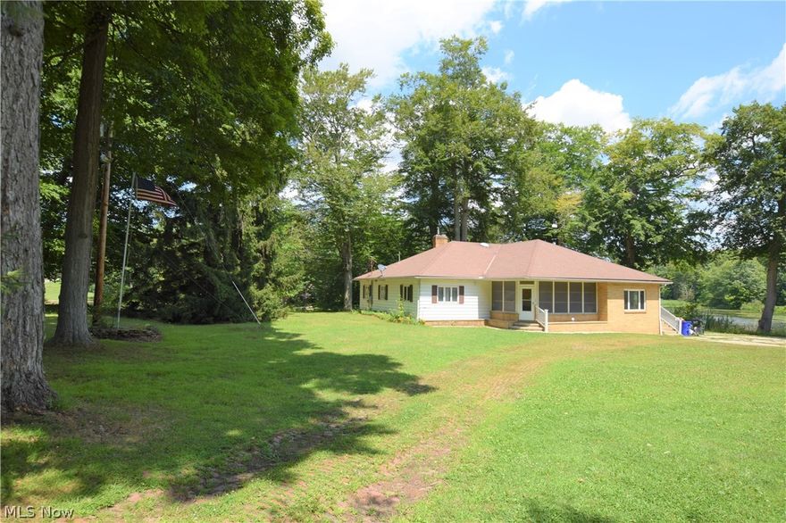 Welcome to 10578 Infirmary Road! This 4-bedroom, 2-bathroom home sits on just over 13.5 acres of land in Mantua. This peaceful property overlooks a large pond and has a massive detached 6-car garage. The spacious living room has beautiful, well-maintained hardwood floors and a brick fireplace. Eat-in kitchen has lots of convenient counter and cabinet space. A door from the kitchen leads to an enclosed back porch – a perfect place to relax, rain or shine. Don’t miss out on this home!