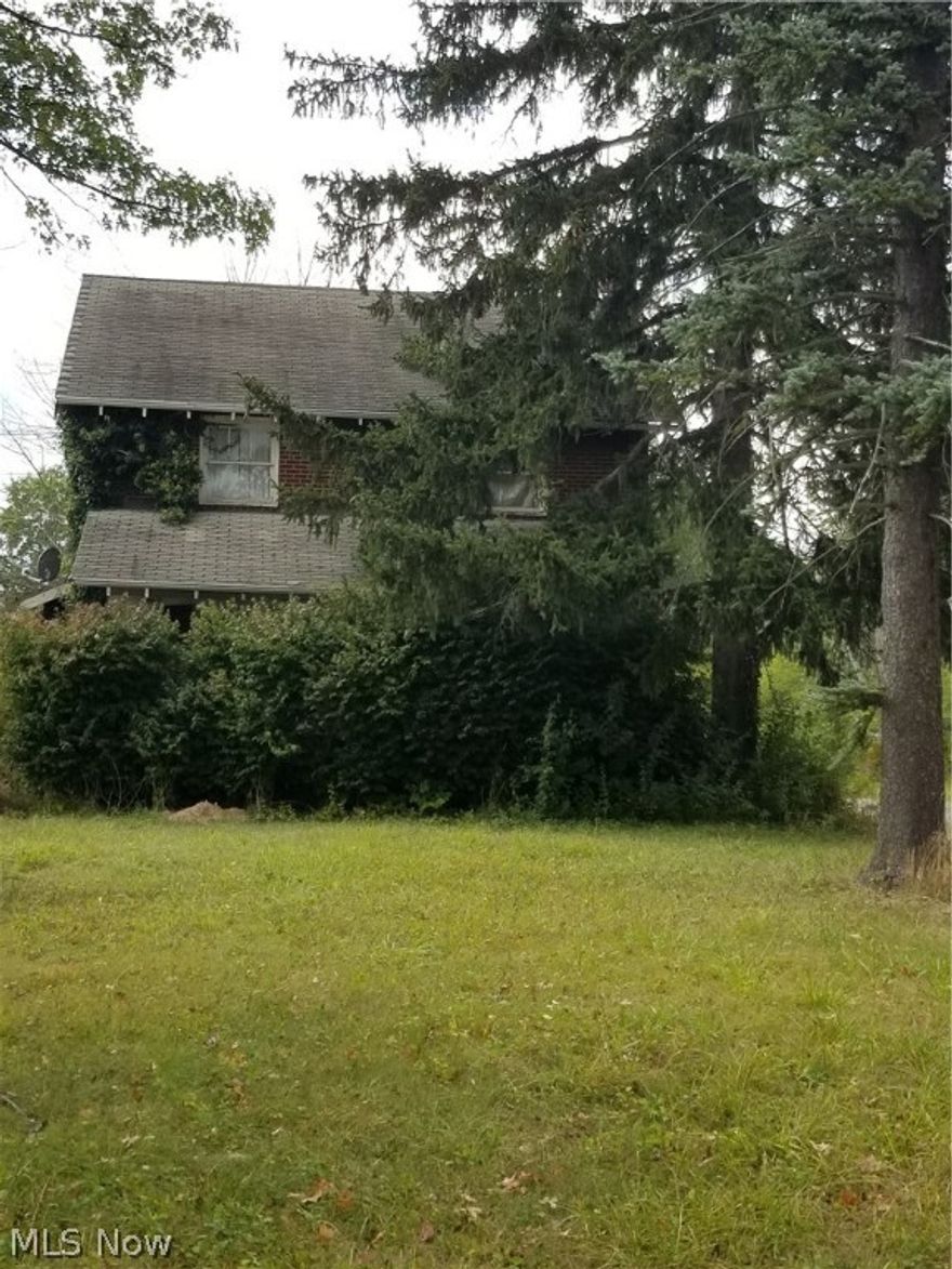 This is property is zoned residential on a commercial strip. There are 2 parcels, one is 99ft wide and the other is 10ft. The depth is approximately 407 feet.