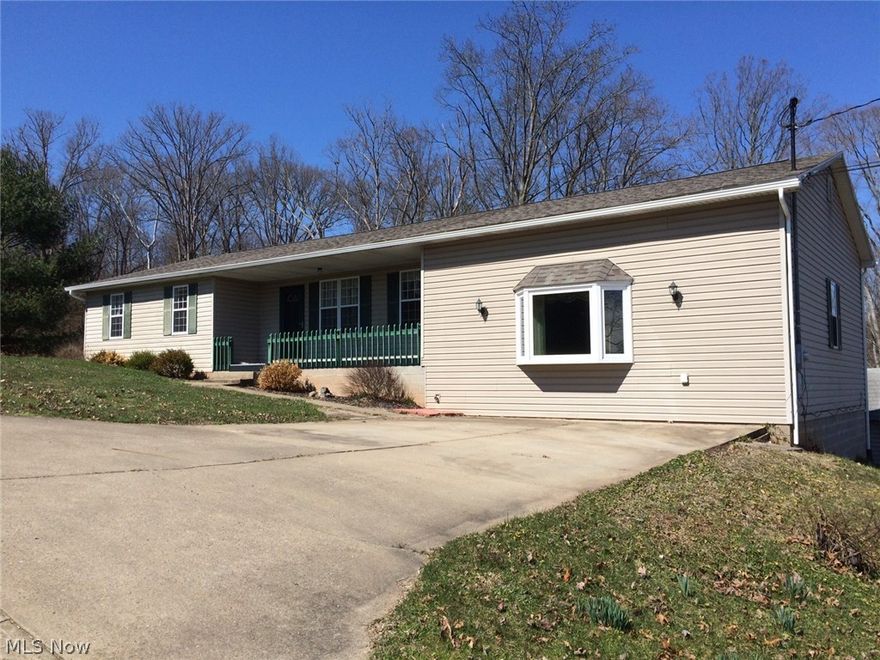 1.59 acres just outside of town, 3 bedrooms, 2 bathrooms, large detached 2 car garage, parking pad for camper or boat, large family room with extra room for toys, etc. could be a walk-in storage closet, new roof and seamless gutters April 2017, double doors from living room to deck, private and convenient.